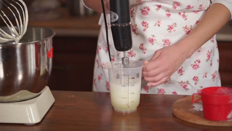 woman baking dessert - mixing ingredients