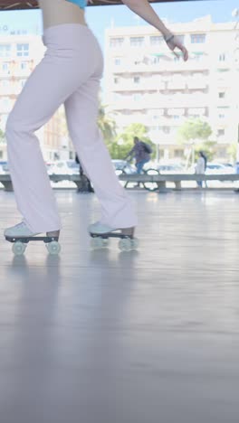 a person roller skating in wide-leg pink pants outdoors