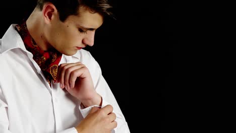 Androgynous-man-adjusting-his-hand-cuffs