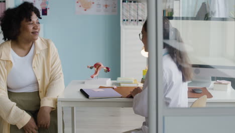 doctor consulting with patient in clinic