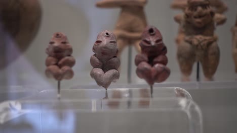 ancient sculptures made of clay inside the palace of cortes in mexico