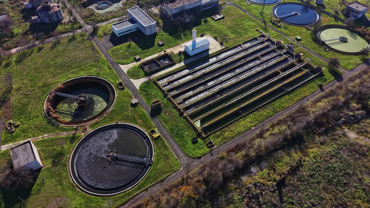 Workers manage a water treatment facility in a clean environment