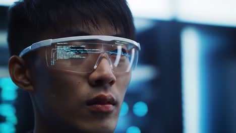 a focused individual with smart glasses analyzing complex data in a high-tech environment, showcasing advanced technology and innovation in modern computing