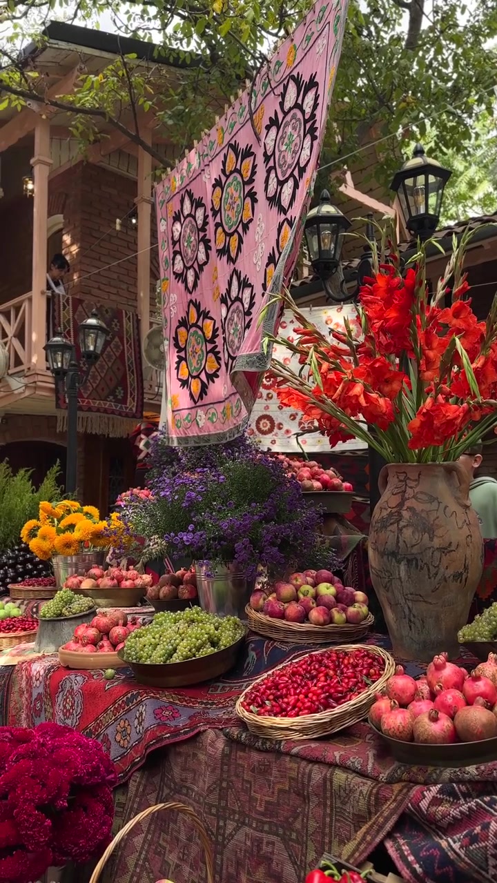Colorful Fruit and Flower Display at an Outdoor Market