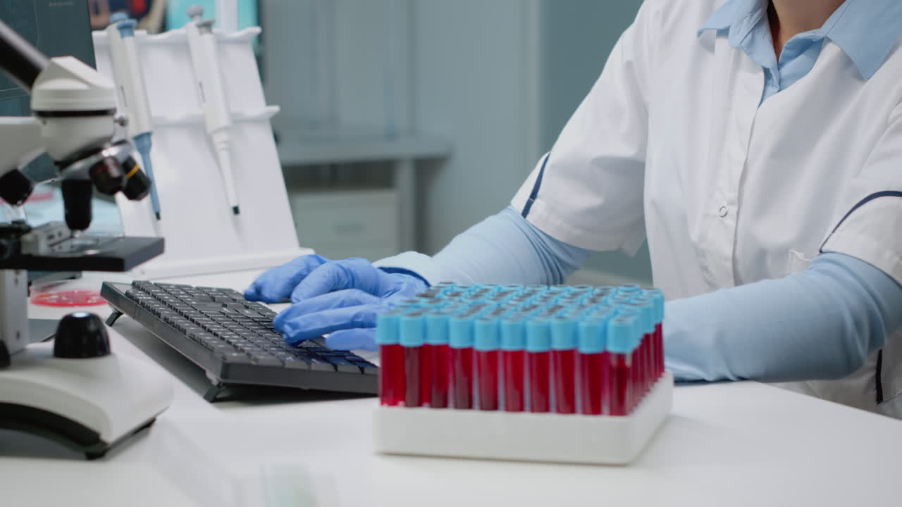 Scientist analyzes blood samples in laboratory