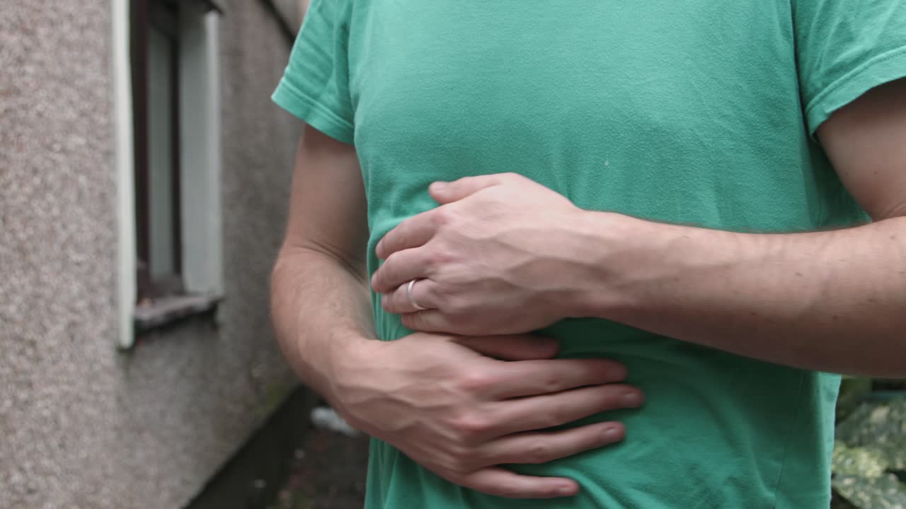Person with Stomach Cramps Internal Pain Needs Medical Attention
