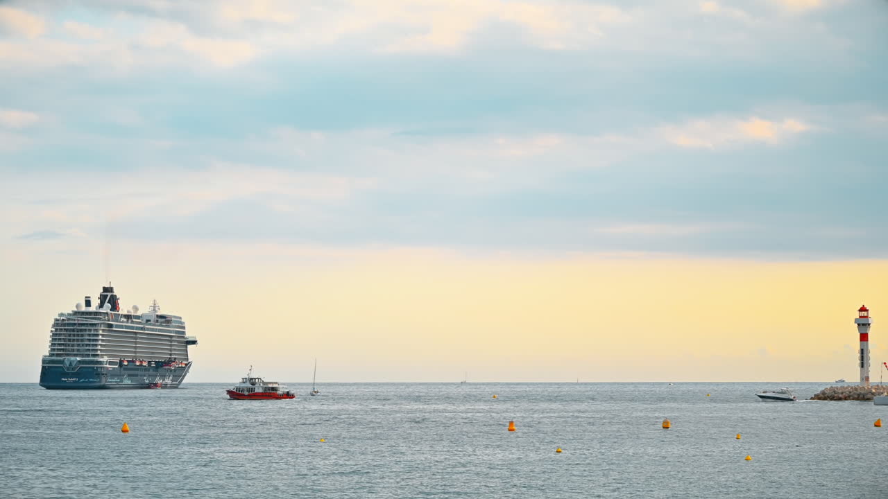 CANNES, FRANCE - AUGUST 28, 2021: Mediterranean sea coast with floating ship and boats