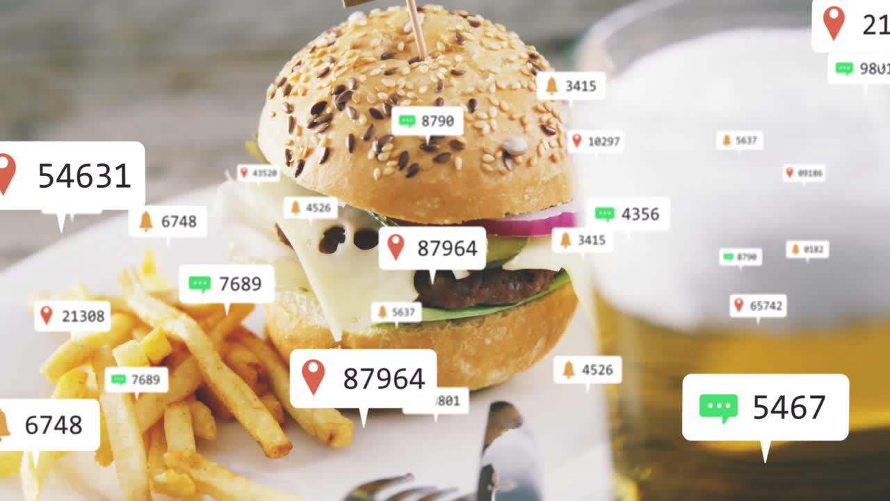Digital data points overlaying scene with burger and fries on table