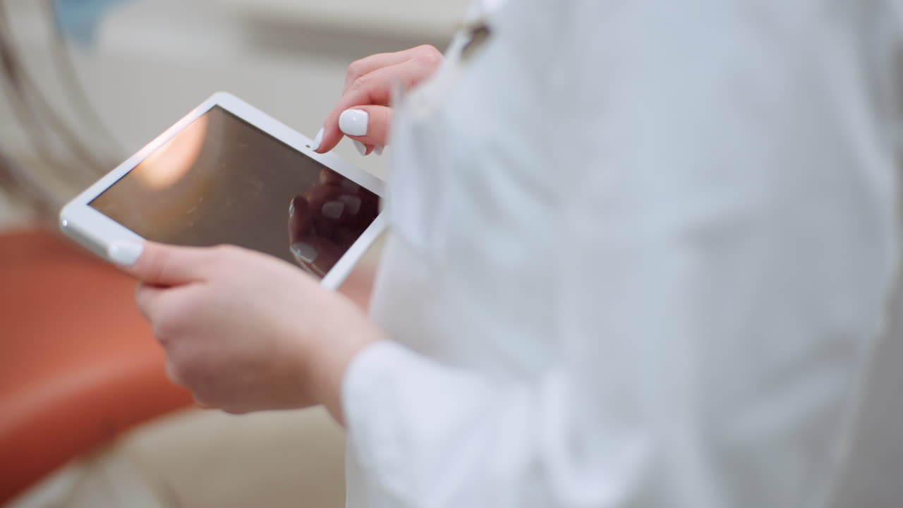 Female Doctor Using Digital Tablet At Dental Clinic 4