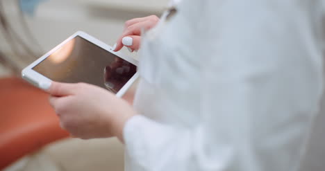 Female-Doctor-Using-Digital-Tablet-At-Dental-Clinic-4