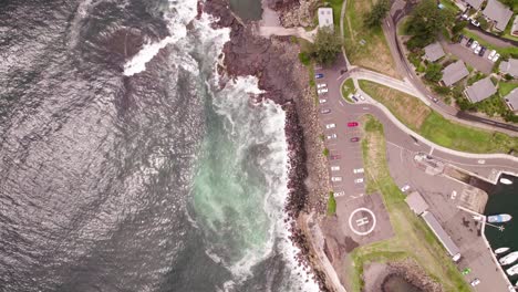 Birds-Eye-pov-aerial-shot,-of-urban-seaside-