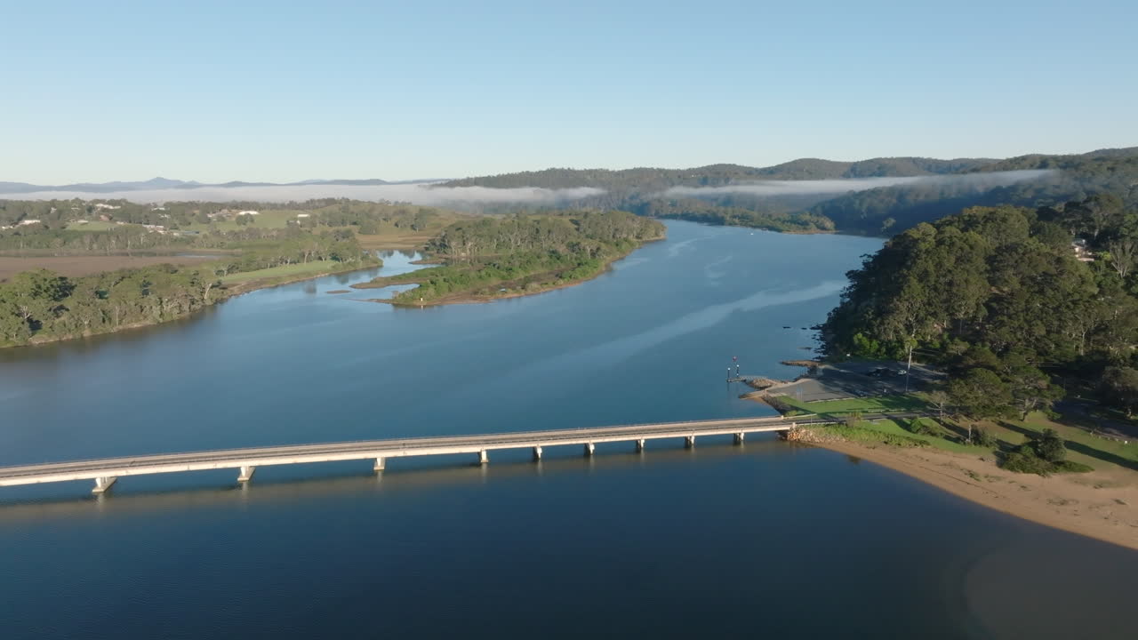 Aerial: Drone shot of a large bridge over the Bega river near Tathra on South Coast NSW, Australia