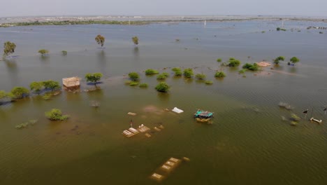 Aerial-View-Of-Large-Swathes-Of-Land-Under-Flood-Water-In-Jacobabad,-Pakistan
