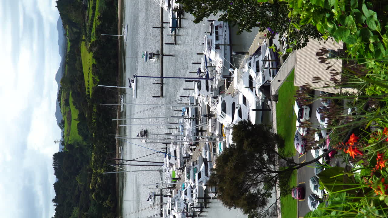 Vertical static view of Queenstown port in moody cloudy weather, New Zealand