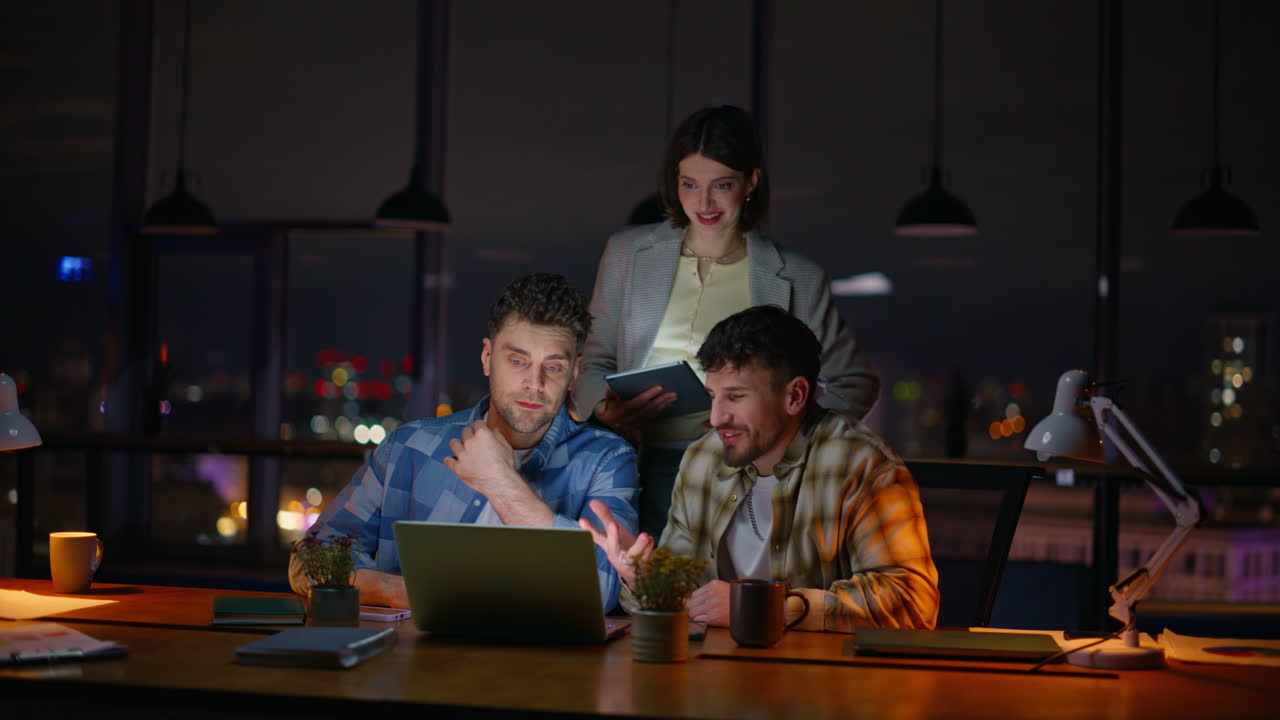 Project managers working late dark office. Team lead woman listening colleagues