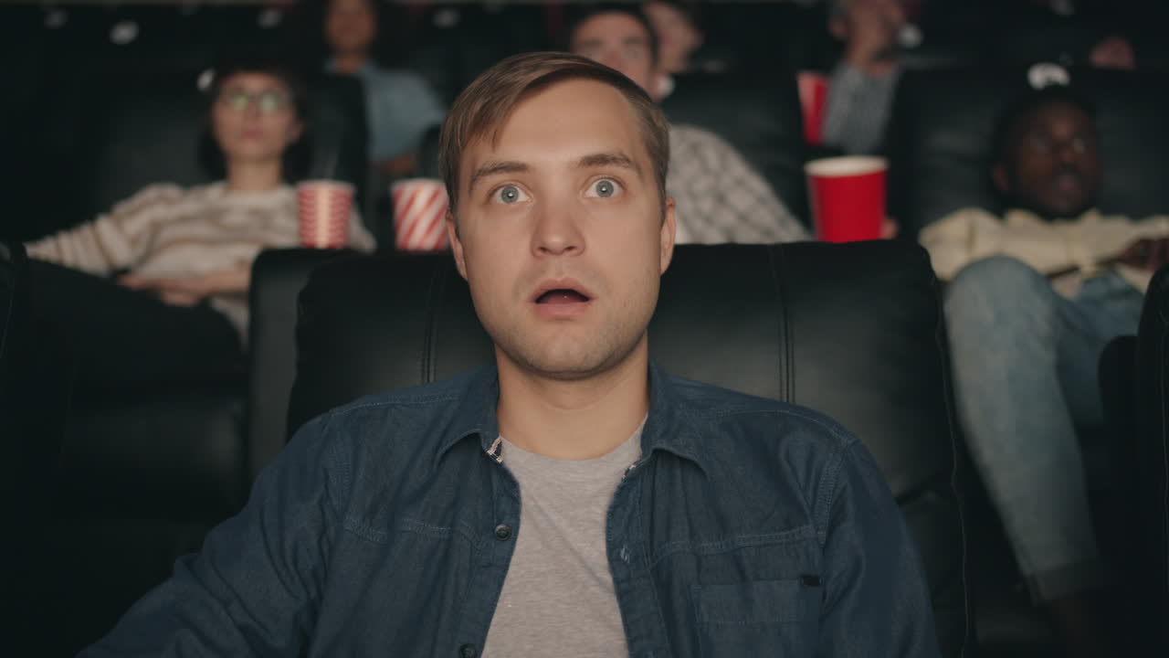 Shocked Man in a Movie Theater