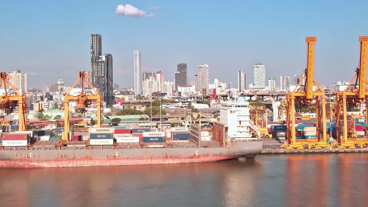 View of Bangkok's skyline with port activities on a busy day