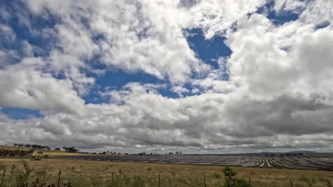 clouds moving swiftly over rural landscape