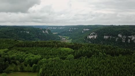 descending over mountains with donau valley in between, overcast sky, eichfelsen germany