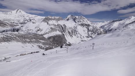 low level flying over ski destination in the alps – dolly in shot - shot in tignes and val d'isere