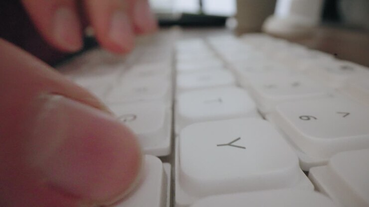 Close-up Moving Macro Shot: Typing On Laptop Keyboard. business man professional user worker using typing on laptop notebook keyboard sit at home office desk working online with pc software