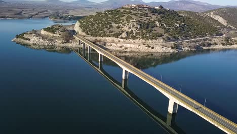 Drone-shot-at-polifitos-lake-bridge,-near-Kozani-in-Greece