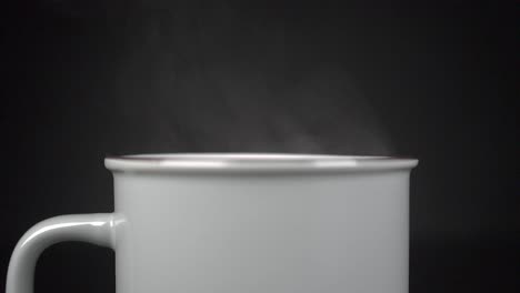 filling cup with hot water with vapour, slow motion 4k