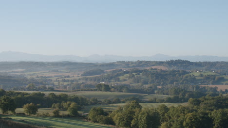 picturesque countryside view with green meadow slopes and dense vegetation