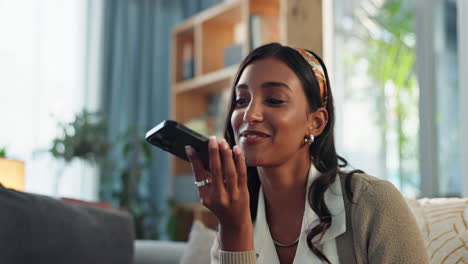 a woman using her phone indoors