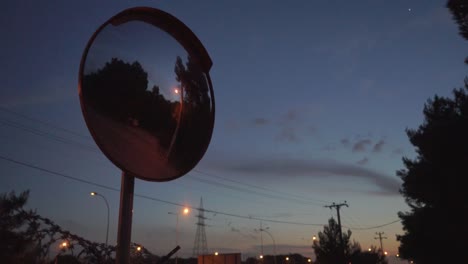 pan footage of traffic mirror sign, evening shot