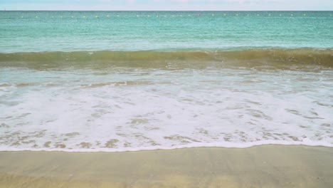 summer holiday concept with waves breaking on shore of holiday beach 5