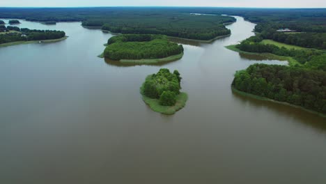 masurian lake landscape with forest and tiny island