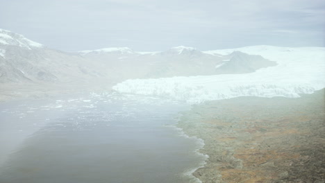 big glacier in mountains in alaska at summer
