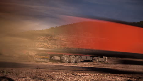 Motion-timelapse-of-tree-trunks-being-loaded-onto-a-lorry-before-it-drives-off