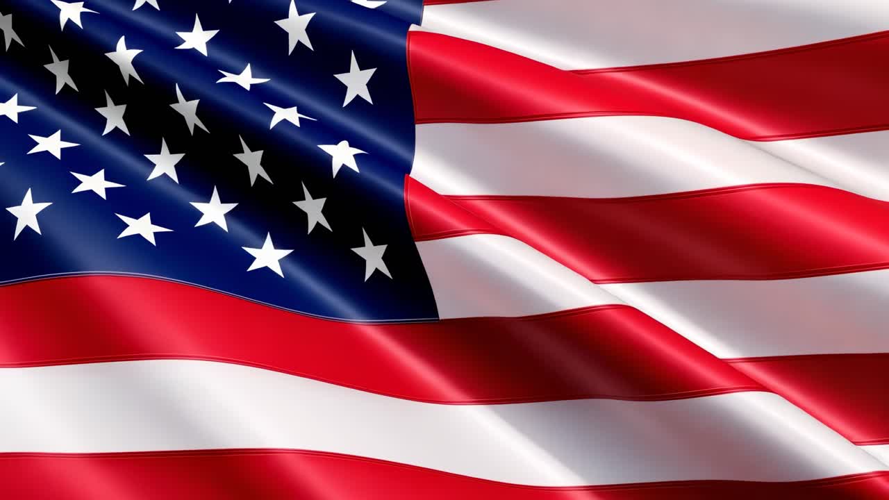 A dynamic video of the American flag waving, captured from a low-angle, showcasing vibrant colors