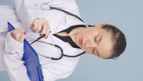 Vertical-video-of-The-doctor-examining-the-paperwork-is-thoughtful.