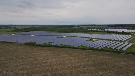 Solar-Farm---Renewable-Green-Energy-And-Electrical-Technology---drone-shot