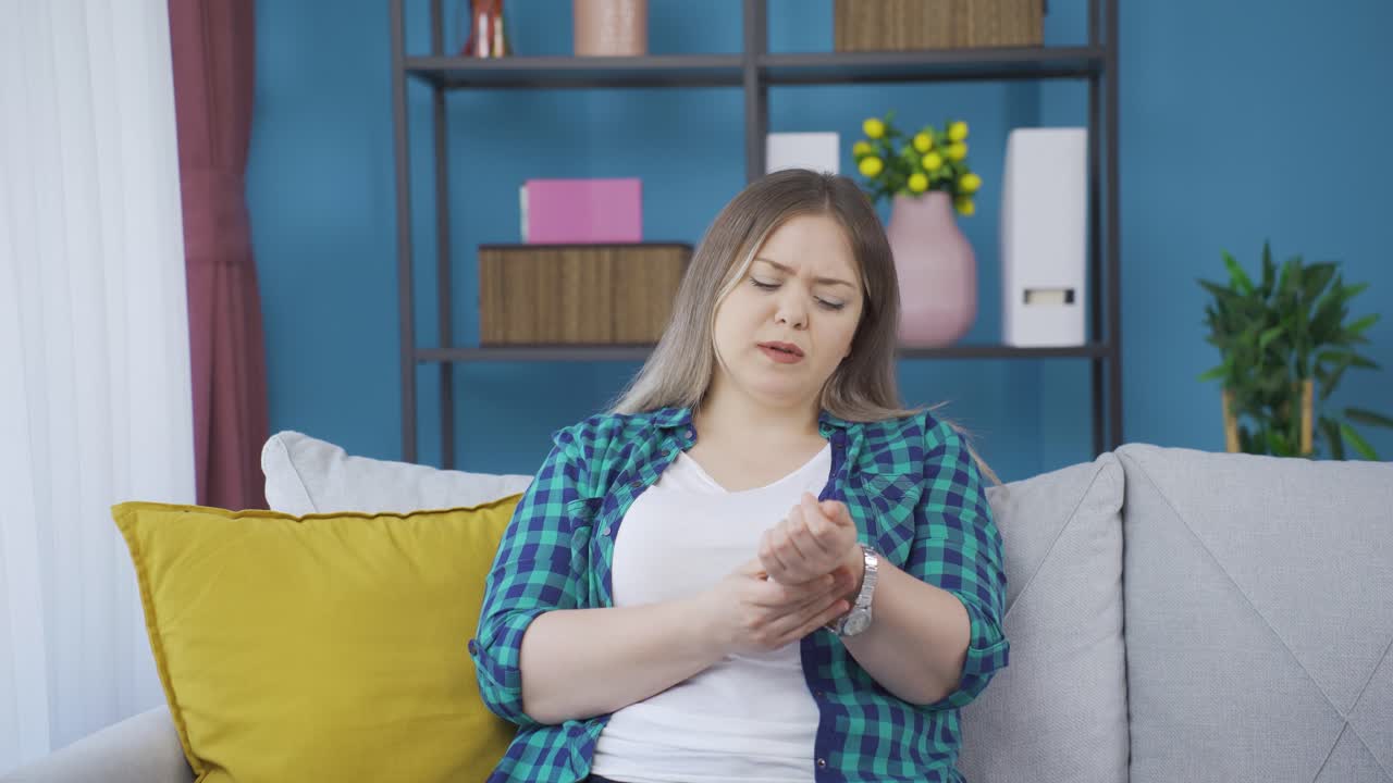 Young woman with wrist pain.