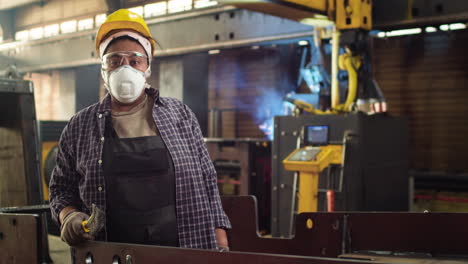 Worker-sanding-down-the-plank