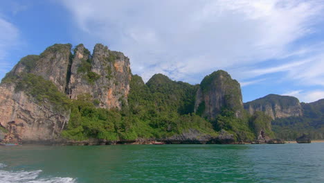 slow motion | view of lush islands in thailand from a boat
