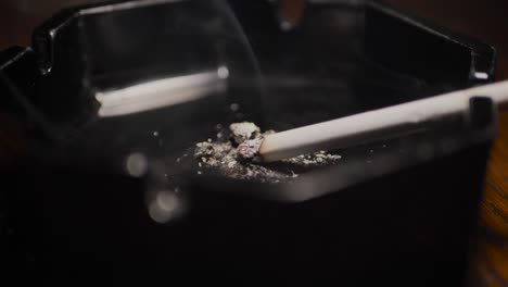 close up smoking cigarette on man hand. slowmotion. scene g