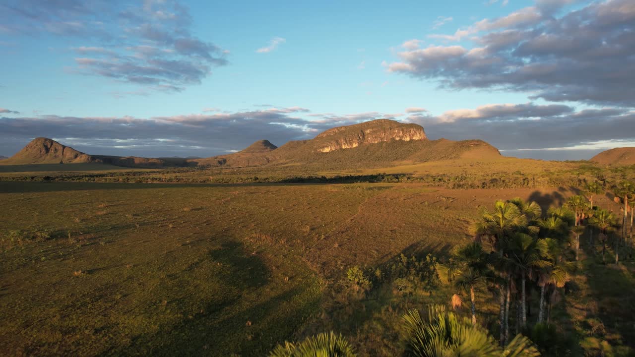 Jardim de Maytrea and Morro da Baleia, panoramic aerial drone view Jardim de Maytrea, green fields, mountains, sunset, Chapada dos Veadeiros, Goiás, Alto Paraíso
