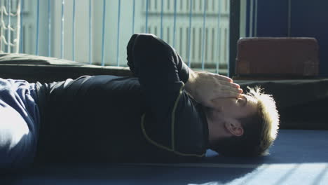 man resting or recovering from exercise