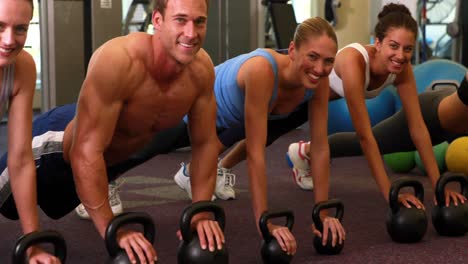 kettlebell class getting into plank position