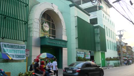 street view of university of the visayas campus entrance in cebi city, philippines. static shot
