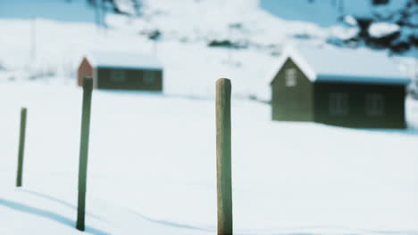 traditional-Norwegian-wooden-houses-under-the-fresh-snow