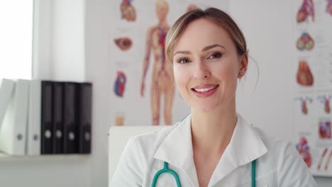 handheld view of young female doctor in her office