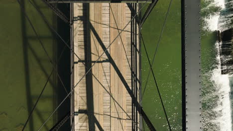 top down aerial of historical steel bridge of war eagle in arkansas, dolly in