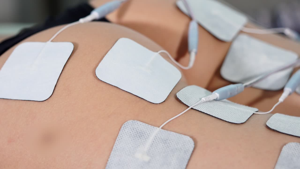 Electrotherapy treatment on buttocks