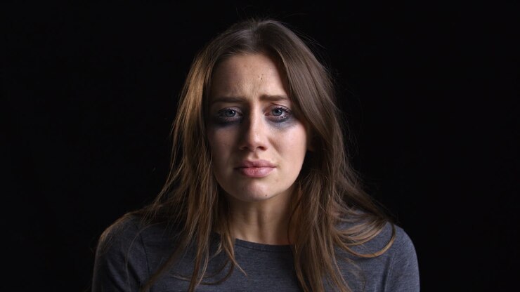 Studio Portrait Shot Of Crying Woman With Smudged Make Up